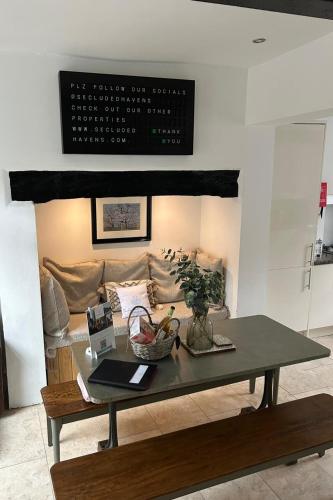 a coffee table in a living room with a couch at Chester Townhouse in the City Centre in Chester