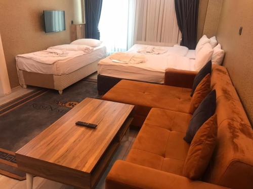 Ένα ή περισσότερα κρεβάτια σε δωμάτιο στο Ruşen otel