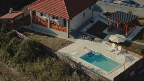 an overhead view of a house with a swimming pool at Avalska Bajka in Ripanj