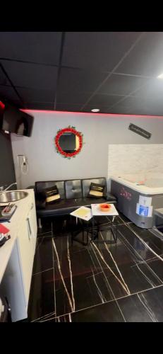 a kitchen with a table and chairs in a room at Ô Saphir Spa - Maison N1 in Denain
