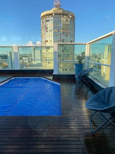 a swimming pool on the roof of a building at B&B HOTEL Uberlândia in Uberlândia