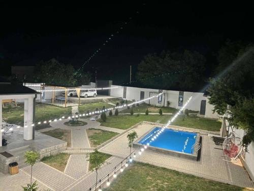 an overhead view of a swimming pool at night at ARThouse Garni in Garni