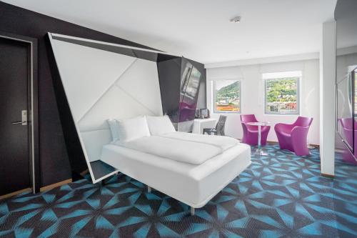 Postel nebo postele na pokoji v ubytování Magic Hotel Solheimsviken