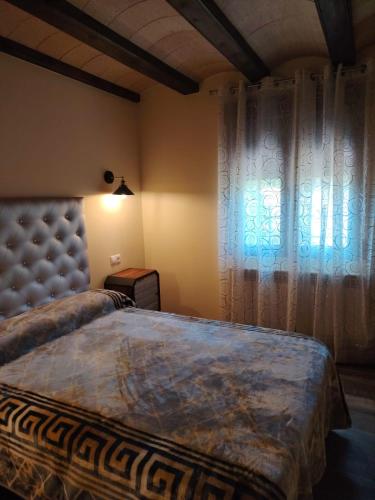Postel nebo postele na pokoji v ubytování La Villa del Barranco