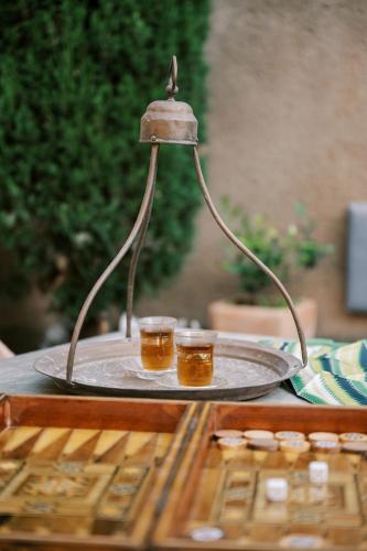 two glasses on a serving tray on a table at Zacosta Villa Hotel in Rhodes Town