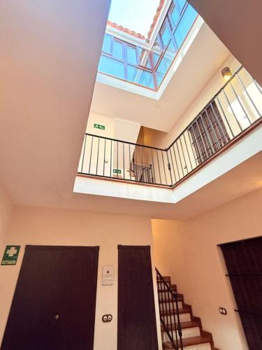 a skylight in a building with a ceiling at Apartamentos Bodeguetas in Constantina