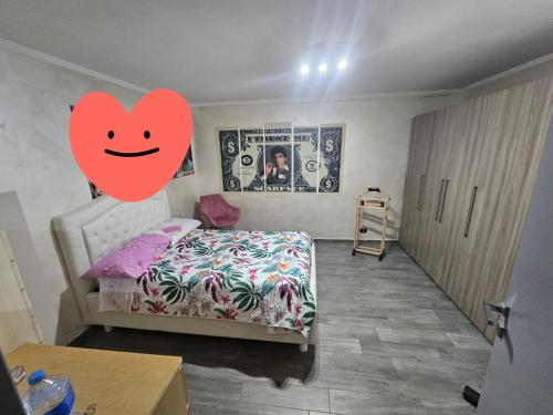 a bedroom with a bed with a smiley face on it at Casa Magica in Pozzo