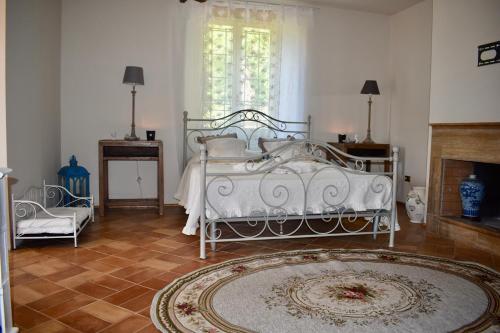 Ένα ή περισσότερα κρεβάτια σε δωμάτιο στο Il Borgo delle Pampare