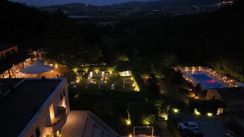 an aerial view of a house at night with lights at Sotto Il Cielo Hotel in Pignola
