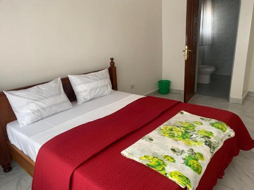 En eller flere senge i et værelse på Chance-Pelé Accommodation