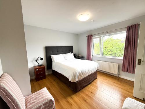 Postel nebo postele na pokoji v ubytování Lynfield Guest House