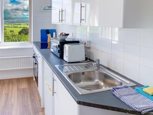 Køkken eller tekøkken på Glastonbury Studio - Tor View - Sleeps 2