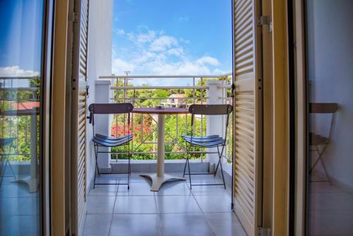 a balcony with a table and chairs and a view at Princess Hotel in Lassi