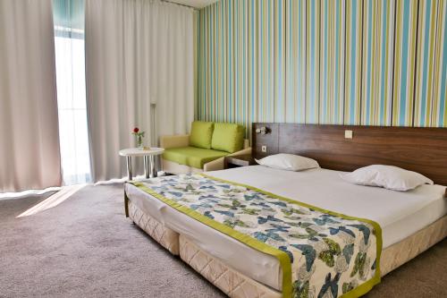 Ένα ή περισσότερα κρεβάτια σε δωμάτιο στο Golden Beach Park Hotel - All inclusive