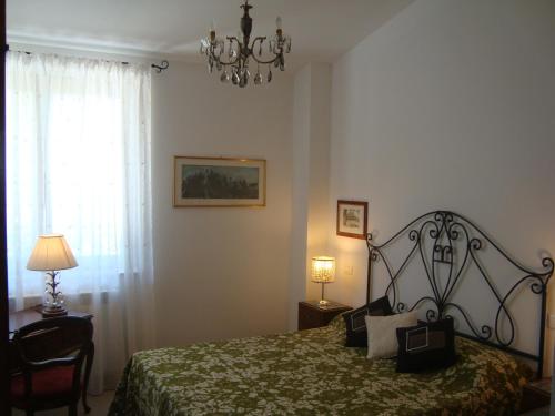 A bed or beds in a room at La Sosta di Braccio
