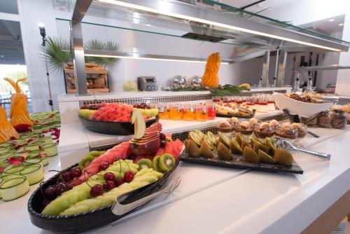 a buffet line with many different fruits and vegetables at Dore Boutique Hotel in Agia Marina Nea Kydonias