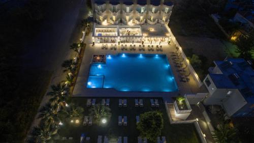 an overhead view of a swimming pool at night at Dore Boutique Hotel in Agia Marina Nea Kydonias