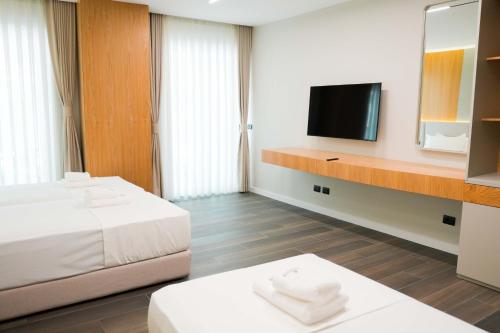 Postel nebo postele na pokoji v ubytování Ilyonis Hotel & Spa