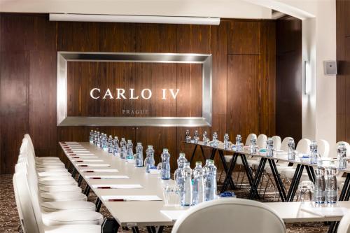 a long table with bottles of water on it at NH Collection Prague Carlo IV in Prague