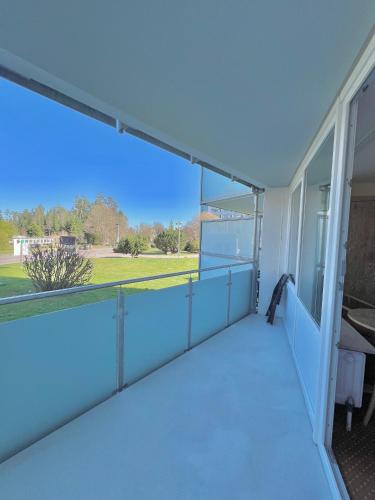an empty balcony of a building with a large window at Schwarzwaldapartment Nr 17 30qm Doppelbettbett Rustikal in Altensteig