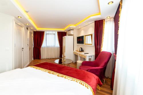 a hotel room with a bed and a chair at Ayasofya Hotel - Special Class in Istanbul