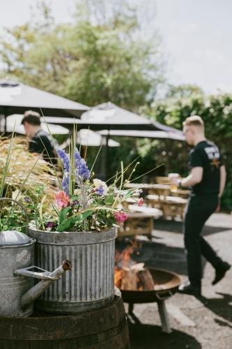 a police officer walking past a table with flowers at The Inverkip Restaurant, Bar & Hotel in Inverkip