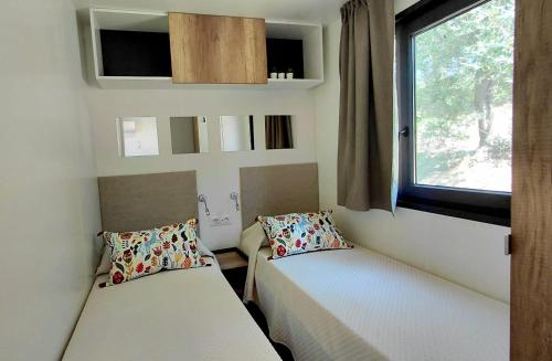 Postel nebo postele na pokoji v ubytování Glamping Tuscany - Podere Cortesi