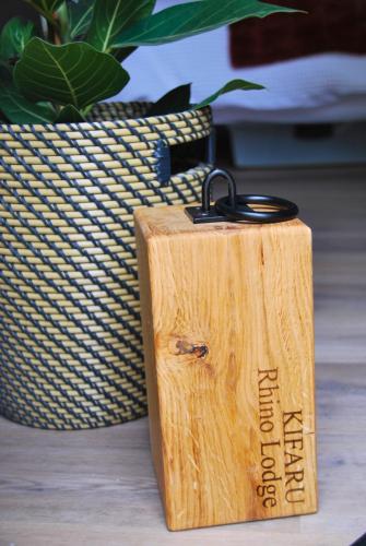 a wooden box sitting on a table next to a plant at Kilima Retreats in West Quantoxhead