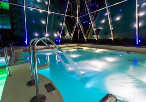 a hot tub on a cruise ship at night at Val di Luce SPA Resort in Abetone