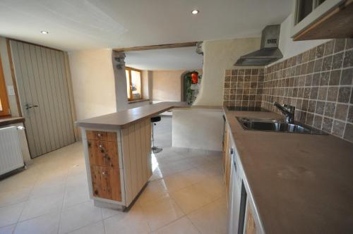 a kitchen with a sink and a counter top at Lakeside Apartment in Ringgenberg