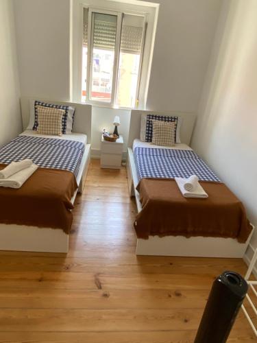 Ένα ή περισσότερα κρεβάτια σε δωμάτιο στο Guest rooms lisbon