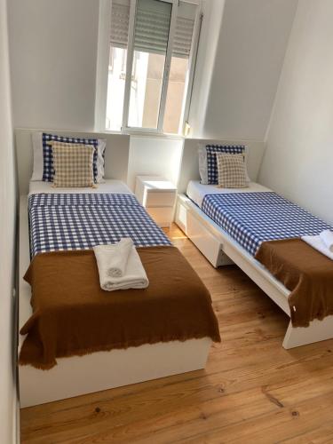Ένα ή περισσότερα κρεβάτια σε δωμάτιο στο Guest rooms lisbon