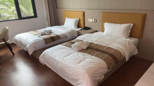 Postel nebo postele na pokoji v ubytování Hotel GoldCoast