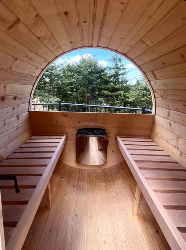 an inside view of a sauna with a window at Villa Lazar in Žabljak