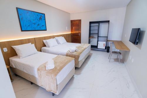 Postel nebo postele na pokoji v ubytování Arrey Express Hotel - Piracuruca