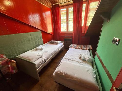 Ένα ή περισσότερα κρεβάτια σε δωμάτιο στο Suite Garibaldi - Sanremo