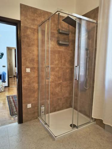 a shower with a glass enclosure in a bathroom at La Terrazza in Tarzo