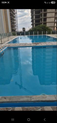 a large swimming pool with blue water at Gonio Pontos Mgzavrebi in Gonio