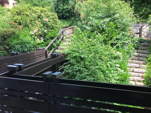 a set of stairs with a black fence at Haus Bachschwalbe in Sasbachwalden