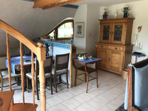 a room with a table and a dining room at Haus Bachschwalbe in Sasbachwalden