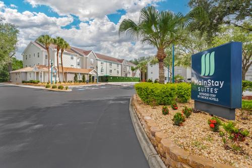 a sign in front of a building with a waleway suites sign at MainStay Suites Tampa Moffitt-USF in Tampa