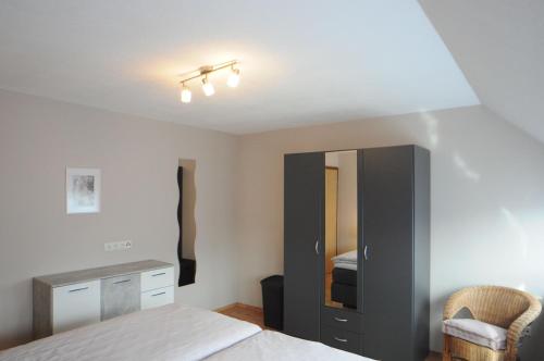 Postel nebo postele na pokoji v ubytování Ferienwohnung Prikker, 65352