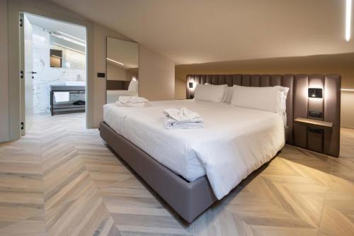 Cama o camas de una habitación en Aurora ApartHotel
