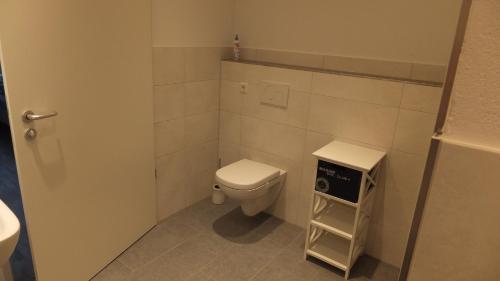 a small bathroom with a toilet and a sink at Ferienwohnungen Manz in Überlingen