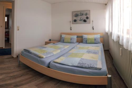 a bedroom with two beds in a room at Ferienwohnungen Manz in Überlingen