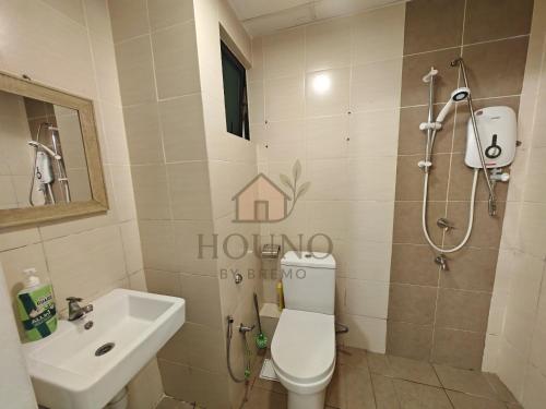 a bathroom with a toilet and a sink and a shower at Houno By Bremo ITCC - Peach in Penampang