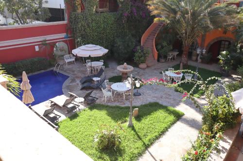 an aerial view of a garden with tables and chairs at Collection O Casa Bella Hotel Boutique, Cabo San Lucas in Cabo San Lucas