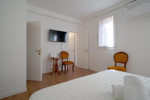 Giường trong phòng chung tại Apartment with court center Venice Historical Center