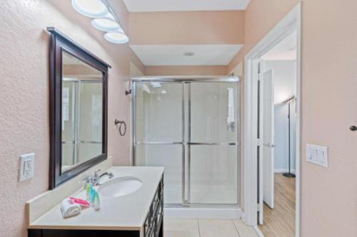 a bathroom with a sink and a shower at 3-Story sanctuary Condo in the heart of Orlando85 in Orlando