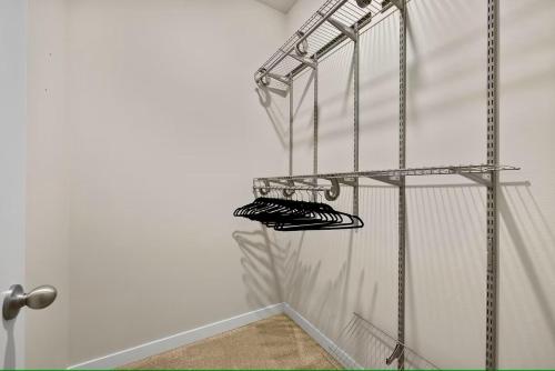 a rack of shoes in a room with a door at 19932 Stylish Spacious 5BR3BA Home in Spanaway in Spanaway